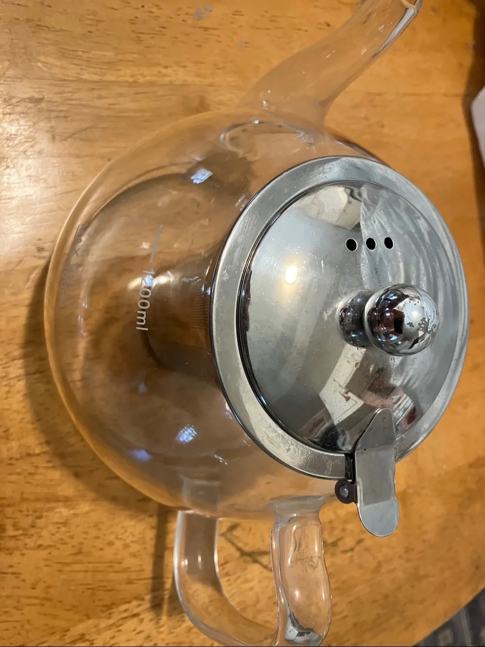 Like new. French press style glass tea pot with stainless steel pieces
